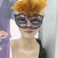 Orange mask with feathers