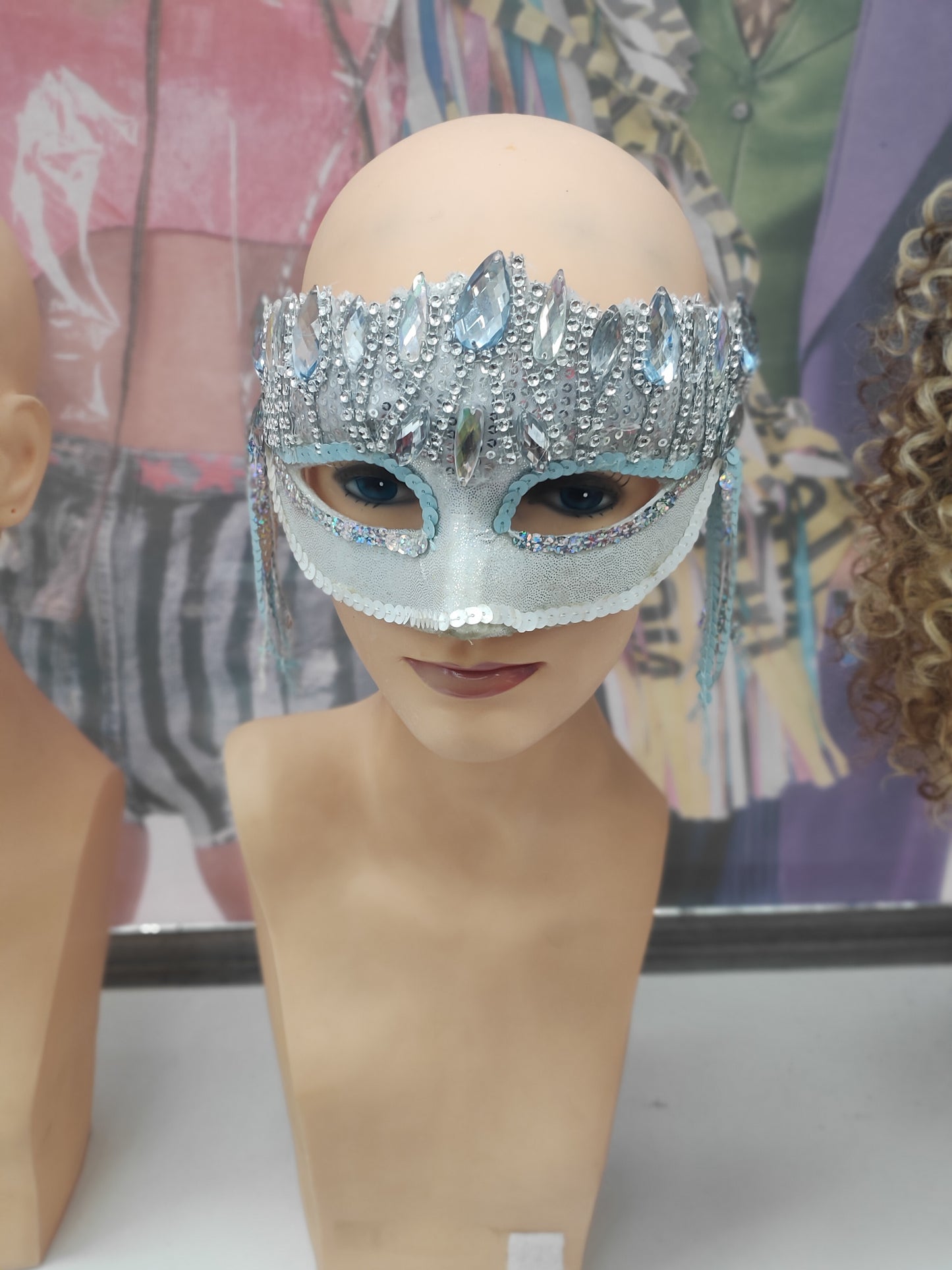 Silver and blue masquerade mask with tassels