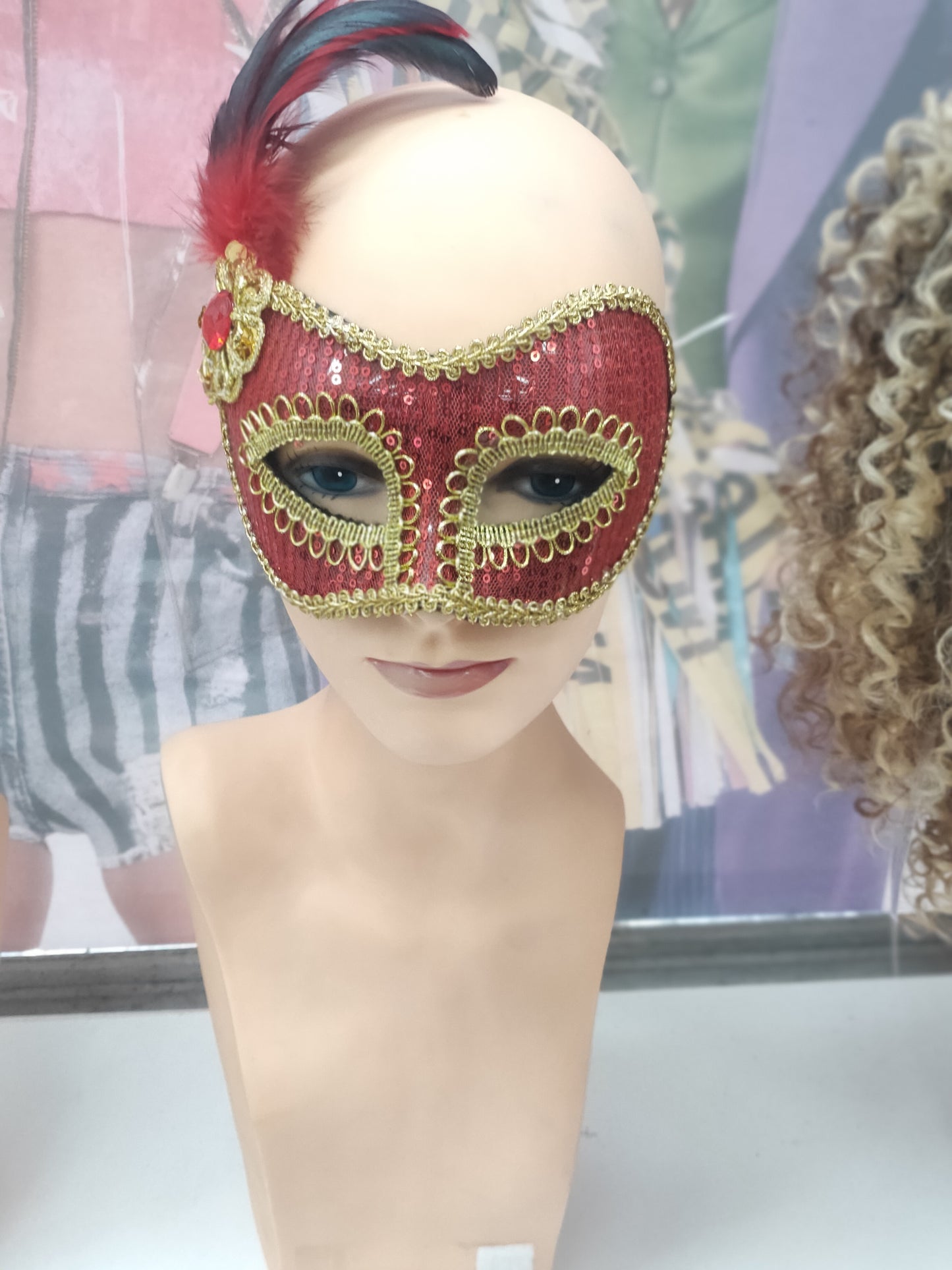 Red and Gold masquerade mask with side feather